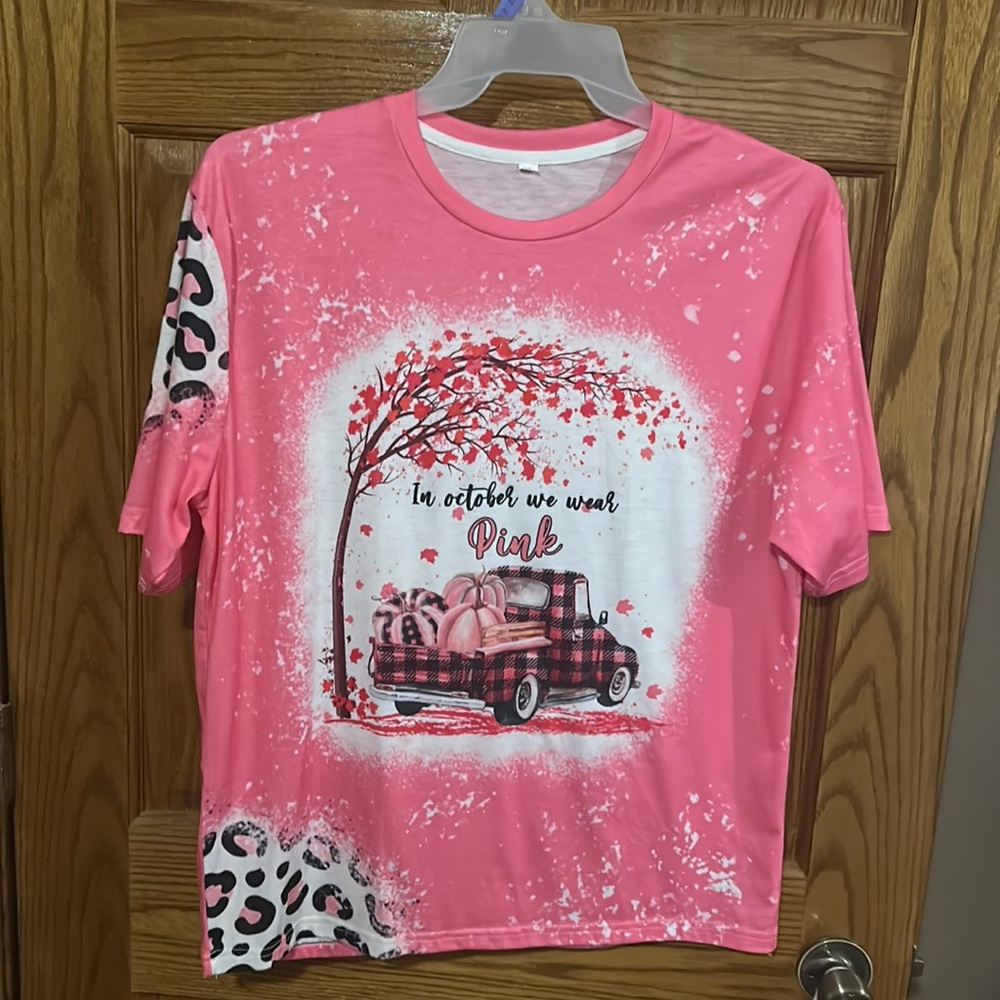 A pink October Breast Cancer shirt.